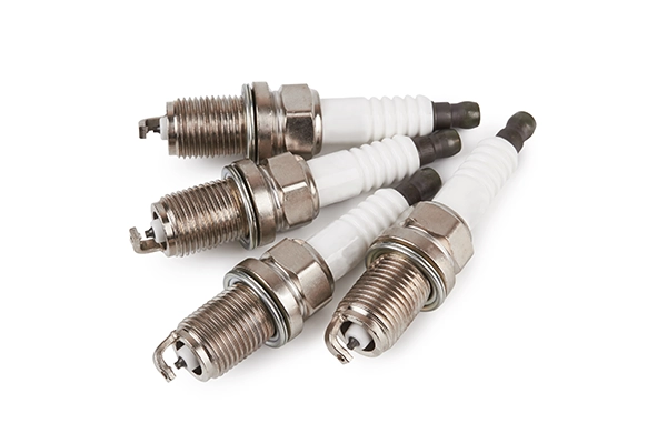New spark plugs on isolated white background
